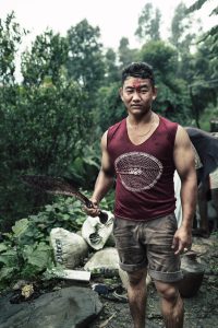 young man slaughtered goats in a local village in Nepal