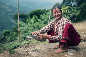the mother from the local village of nepal. wash the dishes