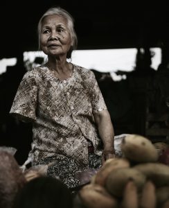 a lady on the market, without arm. vietnam