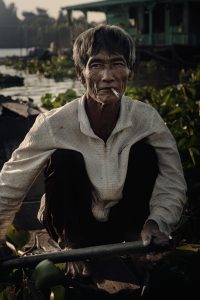 a portrait of an old man from vietnam